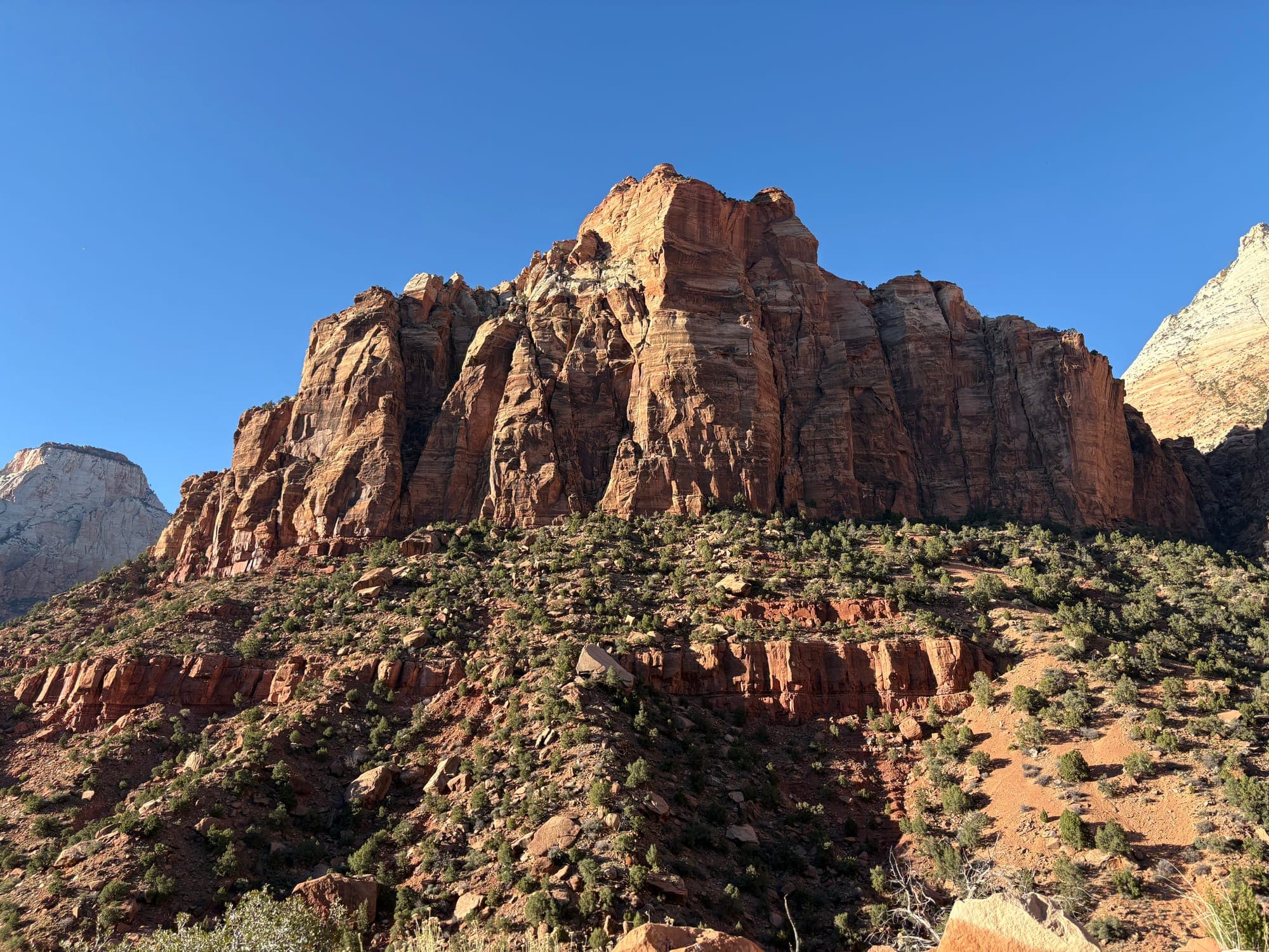 Red sandstone cliffs under a clear blue sky